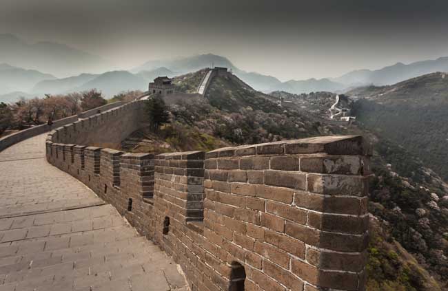 Travel to the Great Wall of China. The Great Wall of China is the largest man-made structure in the world. Flickr/BRJ INC.