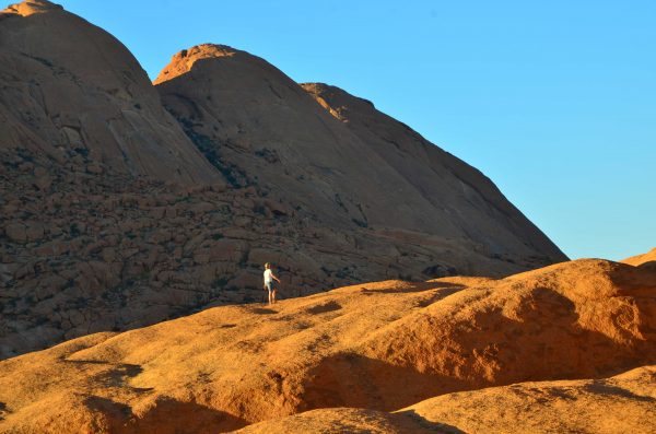 Namibia Travel - Walking on the mars-like mountains of Spitskoppe. Photo by Emma Strumpman