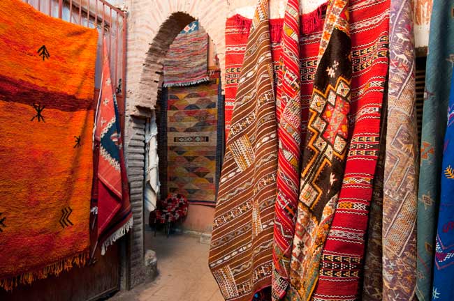 Buying a carpet in Morocco is an unforgettable experience. Photo by Moroccan National Tourist Office.