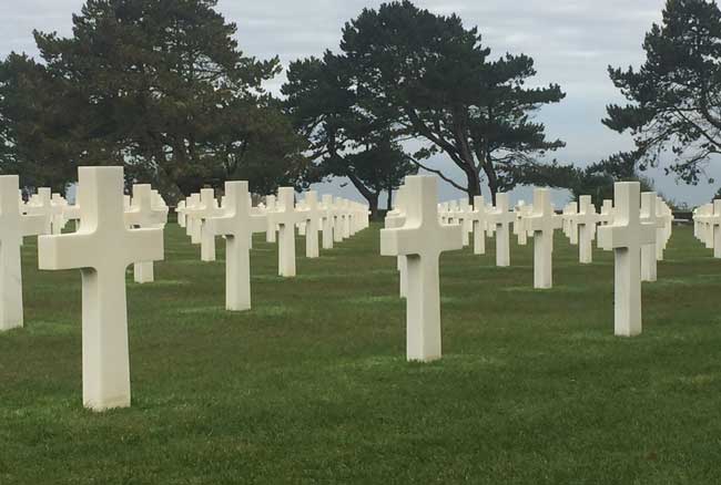 Rows of gravestones at the American Cemetery in Normandy. Photo by Janna Graber