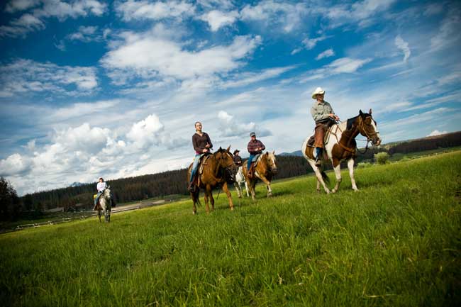 Best Year-Round Colorado Dude Ranches. Guests enjoy an afternoon ride at Devil's Thumb Ranch in Colorado. Photo courtesy Devil's Thumb Ranch