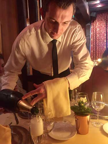 Service with flair at La Couronne in Rouen, France. Photo by Janna Graber