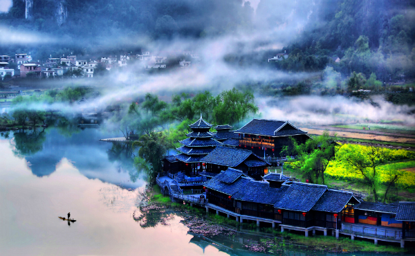 A misty village along the Li River. Photo by Harvey Thomlinson