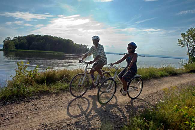 Travel in Vermont means biking along Lake Champlain. Photo by Vermont Tourism