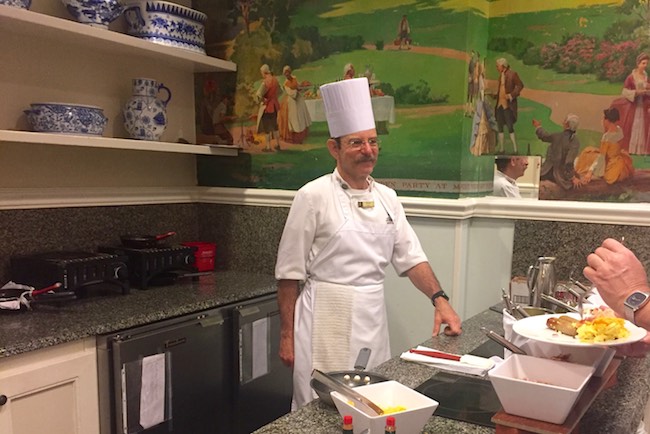 Omelet bar in breakfast buffet room with murals. Photo by Claudia Carbone