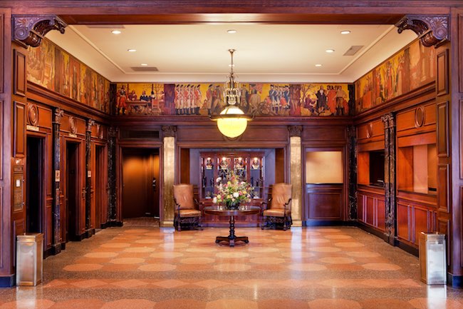 Lobby check-in with original murals depicting colonial Virginia. Photo courtesy of Hotel Roanoke