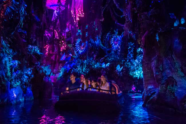 On the Na'vi River Journey, guests sail in reed boats through a bioluminescent rainforest. Photo by Steven Diaz 
