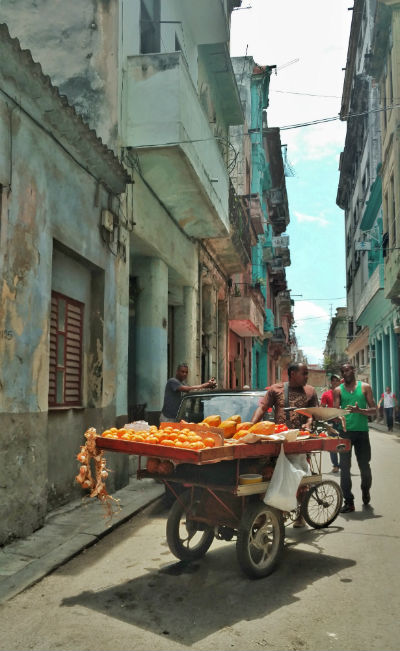 Cuba: A vendor sells fruit in the street. Photo by Christina Lyon