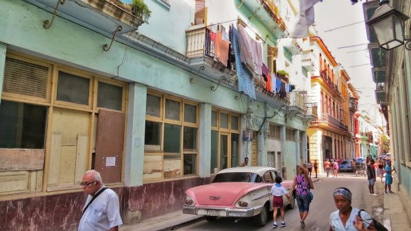 Cuba Daily scenes in Havana: classic cars, people coming and going, and laundry hanging from the aged buildings. Photo by Christina Lyon