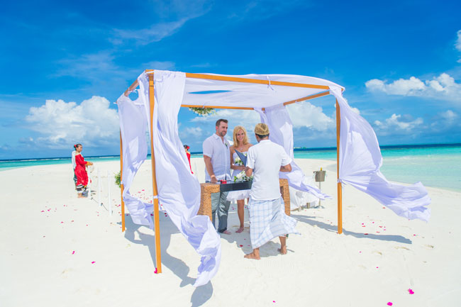 Getting married at Baros in the Maldives. Our Wedding ceremony at The Sandbank, a tiny slip of land just a few minutes from Baros Maldives. Photo by Muha Photos.