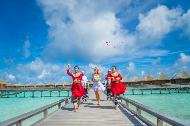 Getting married at Baros in the Maldives. Crossing the lagoon during our wedding procession at Baros Maldives. Photo by Muha Photos 