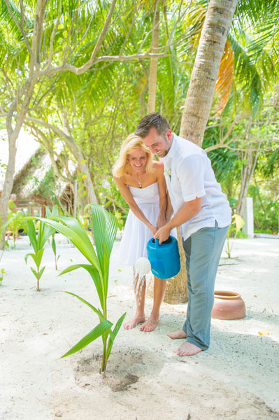 Planting a palm tree at Baros Maldives to symbolize how our relationship will grown. Photo by Muha Photos