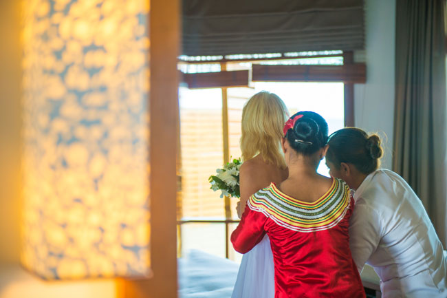 Eloping to the Maldives - Domi and Veda help me get ready for the ceremony. Photo by Muha Photos