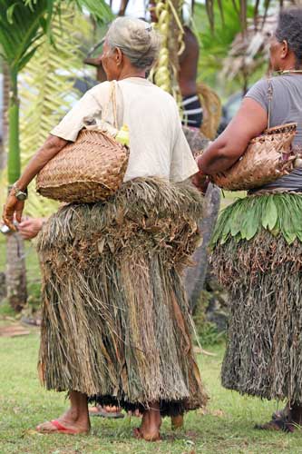 Yap travel - Yapese elders in traditional grass skirts. Photo by Joyce McClure