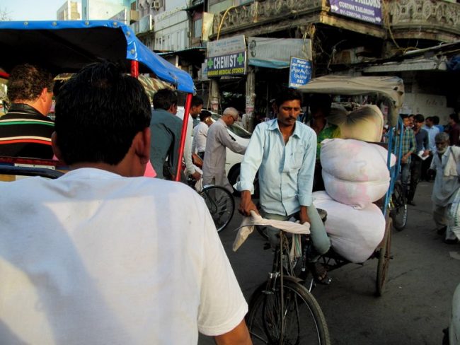 Old Delhi. Often the passenger on a rickshaw is a bale of cotton. Photo by Carol Bowman