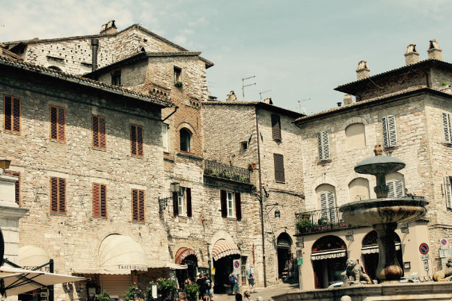 Italy Walking the cobblestone streets of Assisi, we stumbled upon this peaceful but bustling city square. Photo by Vivienne Tam 