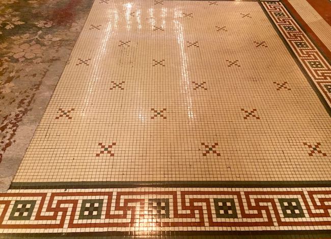 Mosaic tile lobby floor. Photo by Claudia Carbone