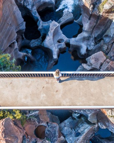 Mpumalanga Panorama Route in South Africa Peering over the bridge at Bourke’s Luck Potholes. These crevices are a result of water flowing through this rocky landscape for hundreds of years. Photo by Luke Maximo Bell