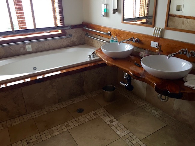 Full bathroom with double sinks. Photo by Claudia Carbone