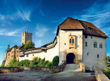 Wartburg Castle, where Luther spent 10 months hiding from potential assassins after the pope declared him a heretic, stands on a mountaintop high above Eisenach. (Photo credit: Anna-Lena Thamm — Thüringer Tourismus GmbH)