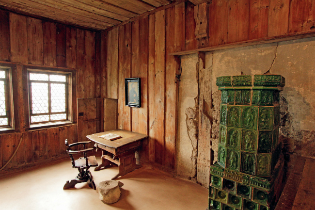 This simple room inside Wartburg Castle is where Luther lived and began his translation of the Bible during the 10 months he resided there. He used the huge whale vertebra on the floor as a footrest. (Photo credit: Andreas Weise — Thüringer Tourismus GmbH)