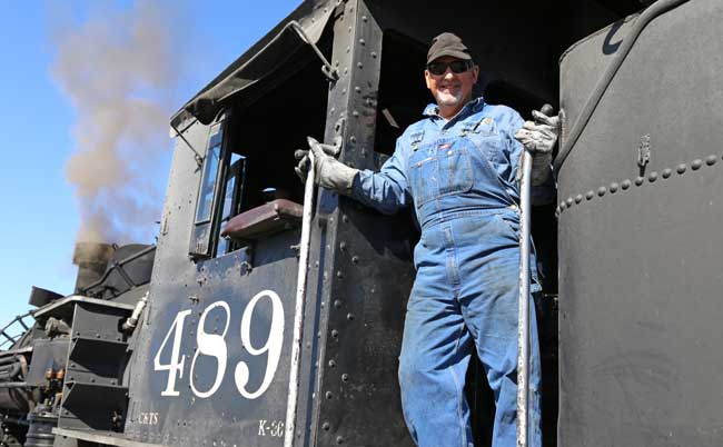 A train engineer aboard the Cumbres & Toltec Scenic Railroad. Photo by Benjamin Rader