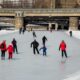 Family ice-skating on the Rideau Canal in Ottawa, Canada