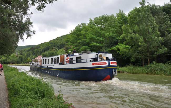 The L’Impressionniste, a luxury hotel barge by European Waterways, cruises through Burgundy, France. Photo by David Powell