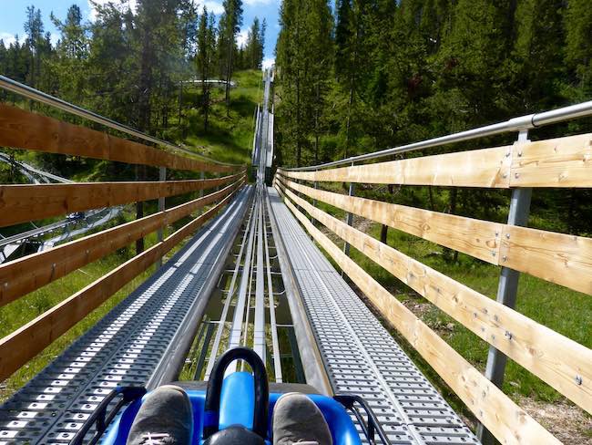 I'm riding the "Forest Flyer" alpine coaster through the trees with gorgeous views of the Gore Range. Photo by Claudia Carbone
