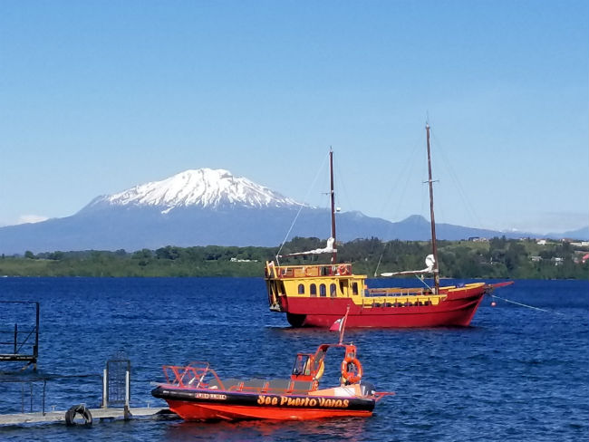 We could see the volcanoes from the banks of Puerto Varas. Photo by Linda Ballou