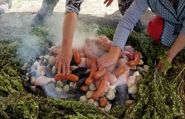 Dining on Curanto in Chile. Photo by Linda Ballou