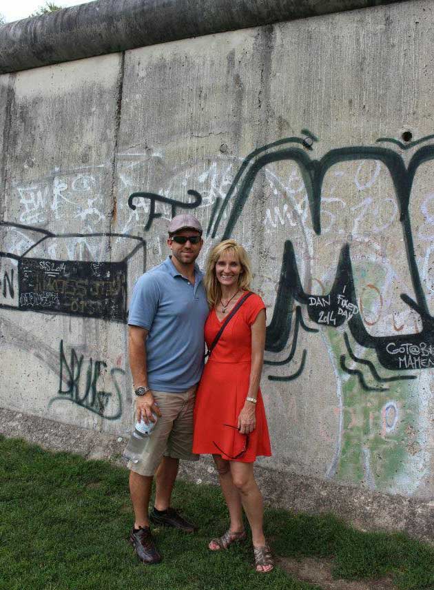 The author and her husband visiting the Berlin Wall today.