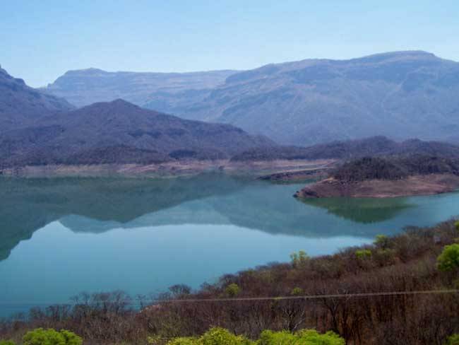 Mountain lakes reflected towering cliffs in the Copper Canyon. Photo by Carol L. Bowman