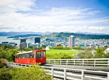 A cable car makes its way uphill on a sunny day in Wellington, New Zealand.