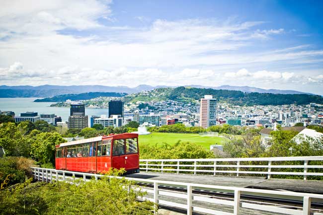 A cable car makes its way uphill on a sunny day in Wellington, New Zealand. 