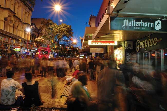 Cuba Street in Wellington at night. Photo by Jessilk