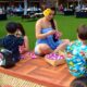 Keiko are shown how to make leis at the Ka Wa’a Luau at the Aulani, A Disney Resort and Spa