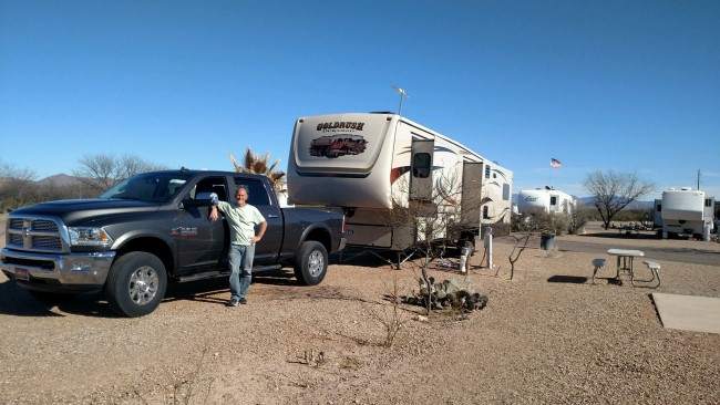 Husband with the fifth-wheel in RV Park.