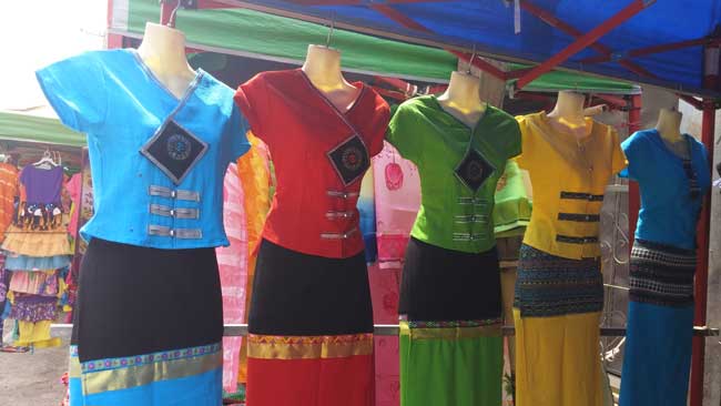 Colorful clothes at a market in Myanmar. Photo by Victor Block