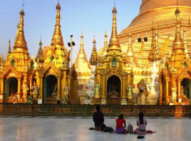 Locals praying at a pagoda in Myanmar. Photo by Victor Block