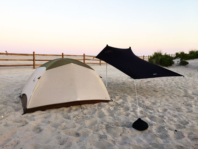 Setting up a two-man tent while camping at Assateague Island National Seashore.