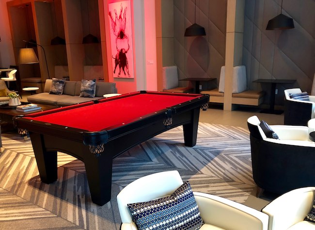 Lobby lounge with pool table. Photo by Claudia Carbone