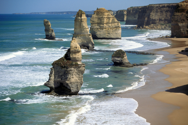 The Great Ocean Road passes by the Twelve Apostles, a collection of limestone rocks near Port Campbell National Park in Victoria, Australia.