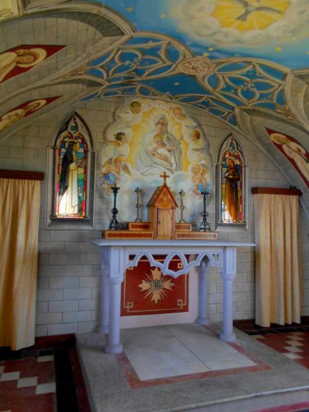 The frescoes and altar inside the chapel were crafted with loving attention and discarded materials. Photo by Carol L. Bowman