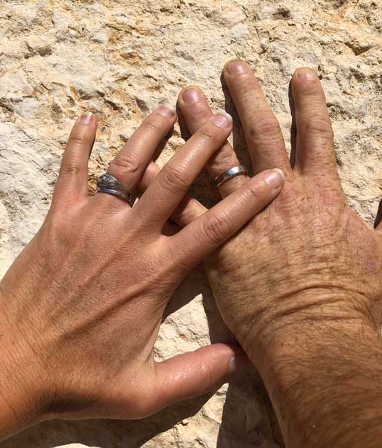 Our Honeymoon in Corfu: Wedding hands on ancient stone in Athens. Photo by Amber Turpin