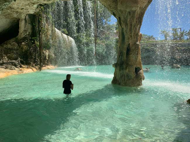 The author at the waterfalls in Saltos Azules in Scape Park in the Dominican Republic.