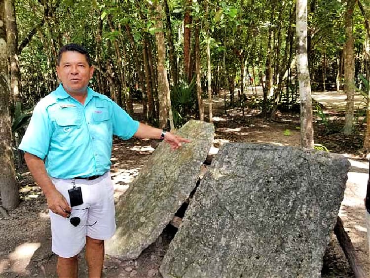 Our Coba, Mexico, guide Gamboa explains what is a stele. 