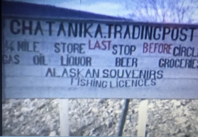 Chatanika Trading Post sign selling gas, oil, liquor, beer and other groceries.