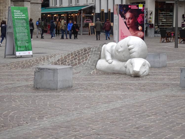 In front of the Antwerp cathedral is the statue of a little sleeping boy. The statue honors the stars of a beloved 19th-century novel called the Dog of Flanders. Photo by Janna Graber