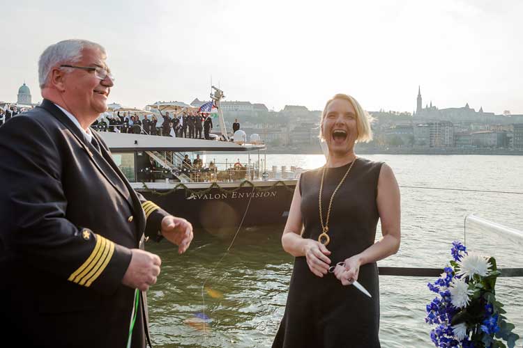 Author Elizabeth Gilbert, godmother of the Avalon Envision, laugh as she cut the ribbon with Captain Ralf Remus. Photo by Avalon Waterways